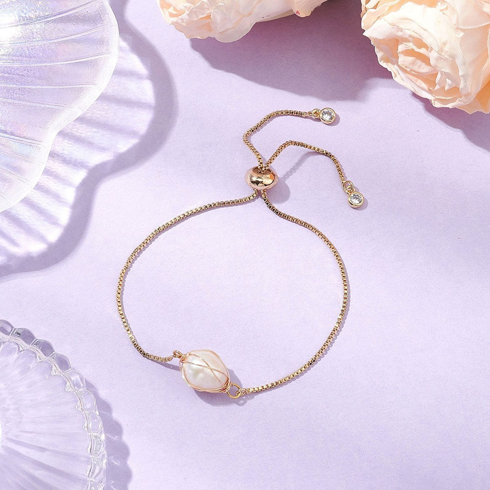 XX05 | Bracelet doré à glissière avec perle blanche naturelle